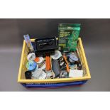 A box of spools of line, various pieces of tackle, float, torch, rest headset etc.