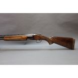 A Miroku 12 bore over/under shotgun, with 26" barrels, quarter and improved choke, 2 3/4" chambers,