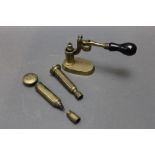 * A brass capper decapper, together with two brass decappers.