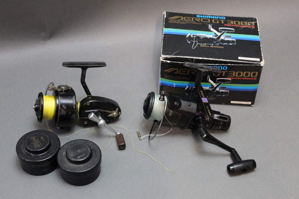 A Shimano Aero GT 3000, together with a Mitchell 300 fixed spool reel with two spare spools.