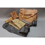 A Brady canvas and leather game bag, containing four gun slips,