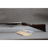 Alex Martin, a 12 bore side by side shotgun with 28" barrels, improved and three quarter choke,