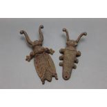 Two cast iron boot jacks in the form of beetles. Length 25 cm and 22 cm.