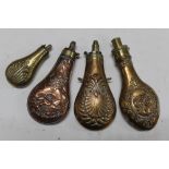 Four antique embossed copper powder flasks, one by Hawksley.