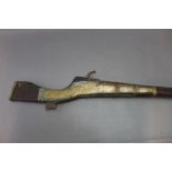* An Eastern Matchlock gun with 42" barrel, flared at the muzzle end,