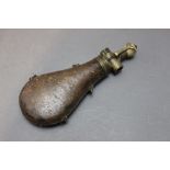 * An unusual flask with a horn topped spring pump charger, the flask with leather covered body,