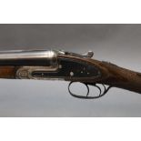A Silver Sable 12 bore side by side shotgun, with 26" barrels, quarter and cylinder choke,