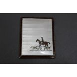 A silver and enamel cigarette case, with huntsman on horseback and foxhound decoration,