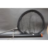 A Sharpes of Aberdeen landing net, 60 cm across, together with a plastic rod tube, 166 cm.