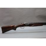 A Baikal 12 bore over/under shotgun, with 26 1/2" barrels, quarter and quarter choke,