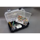 Two plastic fishing boxes, filled with various pieces of tackle to include Priest, Tobys,