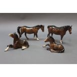 Four brown Beswick horses, to include foal lying, model No. 915, boys pony, model No.