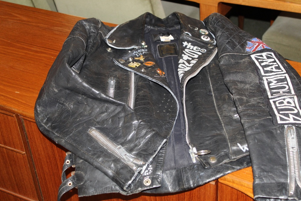 1980's leather "Punk" jacket with various painted an applied adornments/ badges/ motives.