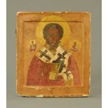 A Russian icon, painted on wood with central figure,
