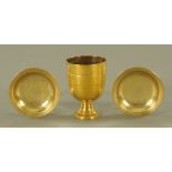 An eastern brass goblet, 11.