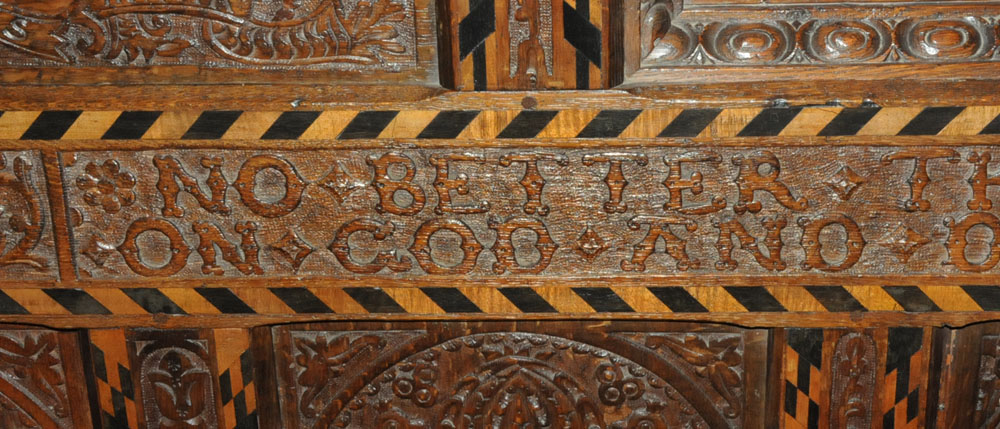 A Victorian carved oak settle, decorated with floral, armorial and religious panels, - Image 13 of 15