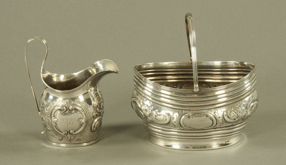 A George III silver helmet form cream jug by JL, with reeded rim and handle,