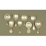 Three George IV silver caddy spoons (various dates and makers),