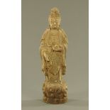 A carved hardwood figure of Guan Yin,