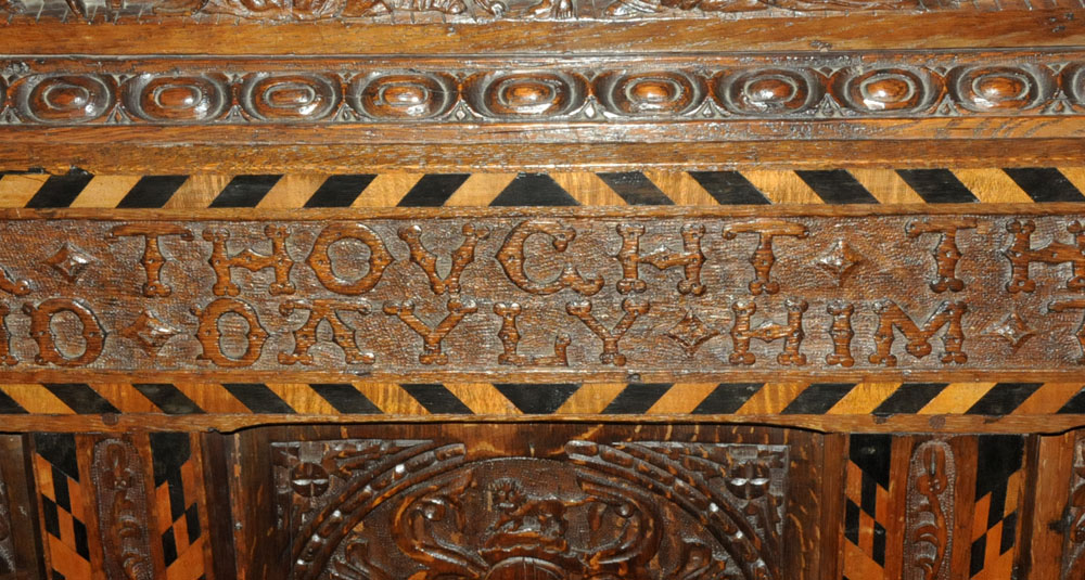A Victorian carved oak settle, decorated with floral, armorial and religious panels, - Image 14 of 15
