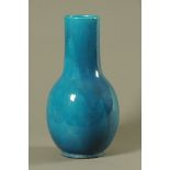 A Chinese turquoise glazed porcelain bottle shaped vase. 43 cm high.