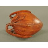 A Chinese carved Huanghuali peach form box, and with open work leaf form handle. 13 cm wide.