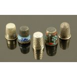 Five silver and metal thimbles, two enamelled.