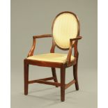 A reproduction mahogany open armchair,