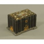 A Victorian black papier mache rectangular tea caddy, of shaped outline,