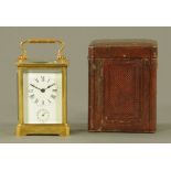 A French brass carriage clock, timepiece with alarm with Roman numerals,