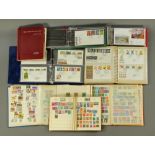 Four albums of first day covers +/- 100, plus four albums of mint unused world stamps.