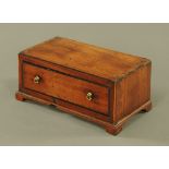 A George III mahogany single drawer box, with crossbanded top and drawer front, on bracket feet.