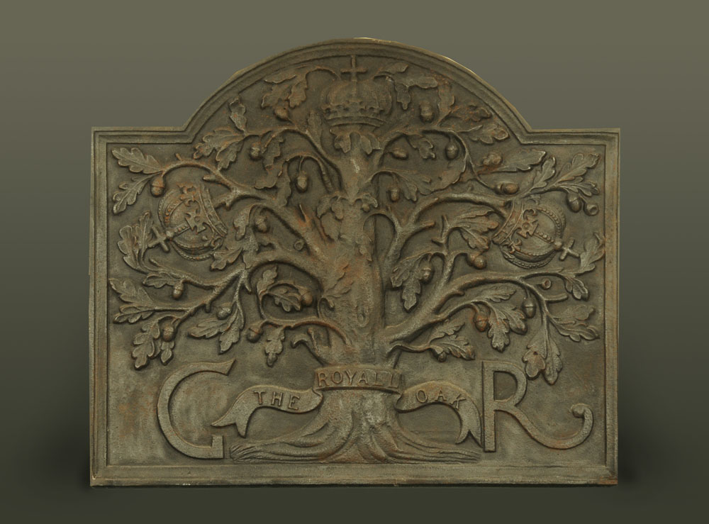 A cast iron fire back "The Royal Oak", also moulded GR. Height 76 cm, width 89 cm.