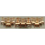 A set of nineteen George III mahogany dining chairs (including two armchairs) of Hepplewhite design,