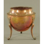 A copper bulbous jardiniere of Arts and Crafts design on three splayed legs,