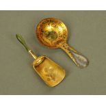 An early 20th century printed and gilded tin, advertising caddy spoon for "Namunah 3 T's",