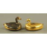 A papier-mache duck form lidded box, decorated in gilt, 11 cm high, and a similar ditto, 12 cm high.