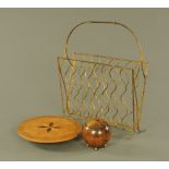 A gilt painted wirework magazine rack, 54 cm high x 42 cm x 17 deep, an oak spherical tea caddy,