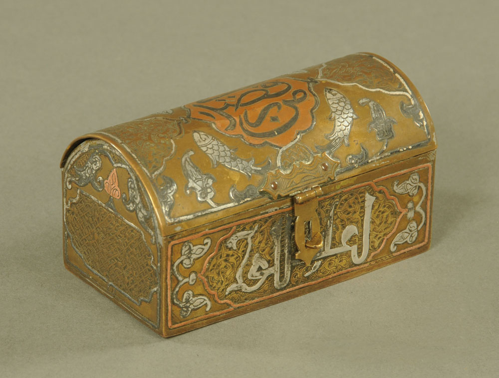 An antique Cairo ware fish decorated dome topped box. Length 11 cm.