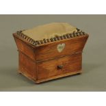 A William IV Rosewood sewing box, the angled pin cushion top with beaded moulding,