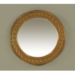 A Keswick School of Industrial Arts mirror frame, circular with bevelled glass, stamped K.S.I.A.