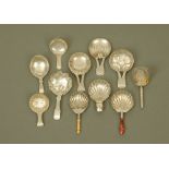 Eleven George III and later silver caddy spoons by John Lawrence & Co,