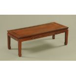 A Chinese hardwood rectangular Kang style coffee table. 41 cm high, 124 cm wide, 51 cm deep.