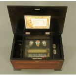A 19th century Swiss "Bells in Sight" musical box, with 15 cm comb and playing eight airs.