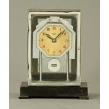 A Bulle electric mantle clock 1930's, in oak with chrome case.