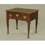 An 18th century oak side table, the moulded rectangular top above a single drawer and turned legs,