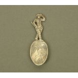 An early Victorian cast silver harlequin form caddy spoon, with figural terminal,