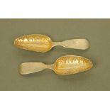 A pair of William IV silver gilt fiddle pattern caddy spoons with embossed leaf bowls by William