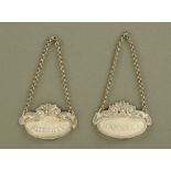 A near pair of 18th century white metal decanter labels,