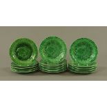 A set of twenty two Victorian green glazed Majolica strawberry plates, 22 cm diameter.